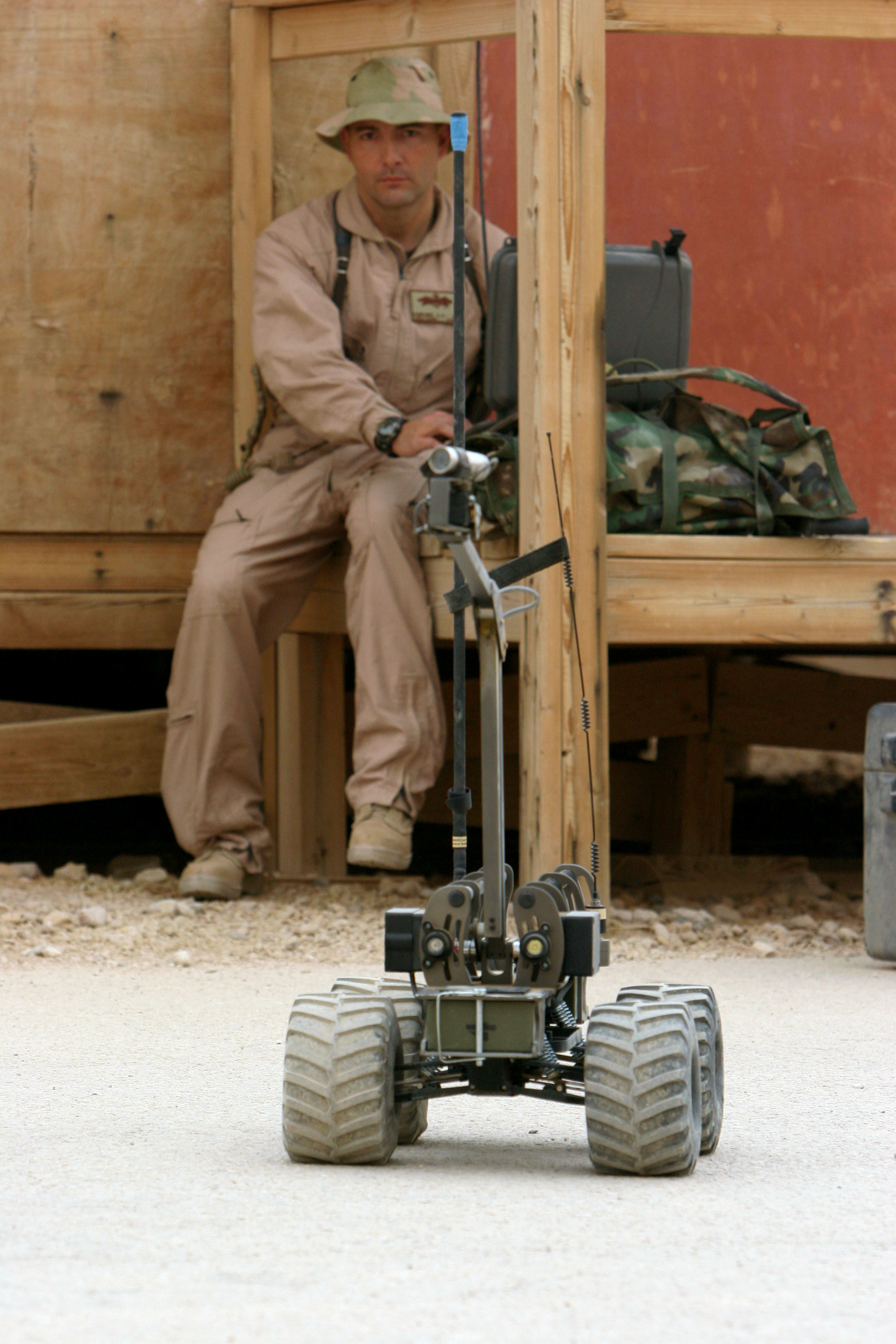 080326-N-9623R-007 Iraq (March 26, 2008) Construction Electrician 2nd Class Greg Martinez, assigned to the convoy security element (CSE ) of Naval Mobile Construction Battalion (NMCB) 17, controls the MARCBOT IV, a remote controlled vehicle mounted with a video camera which is used to investigate suspicious areas without putting team members at risk. NMCB -17 CSE teams are highly trained Seabees tasked with the safe movement of various convoys to and from their missions. NMCB-17, also known as the "Desert Battalion", is to Iraq and other areas of operations supporting Operation Iraqi Freedom and Enduring Freedom. U.S. Navy photo by Mass Communication Specialist 2nd Class Kenneth W. Robinson (Released)